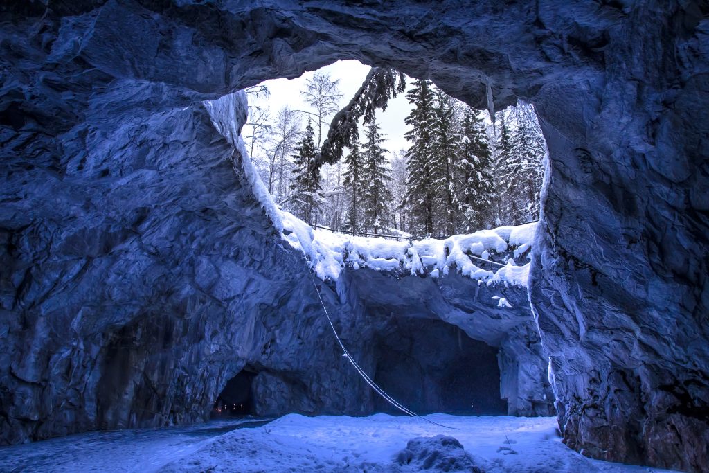 Cave with ice. Karelia in the winter. Settlement Ruskeala in Russia.